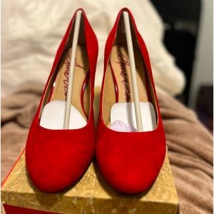 Red faux suede pumps